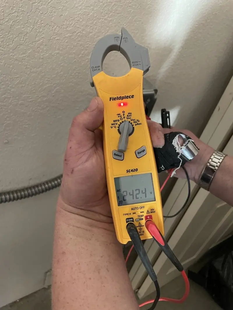 Voltage testing with clamp meter during Ceiling Fan Installation in Owensboro